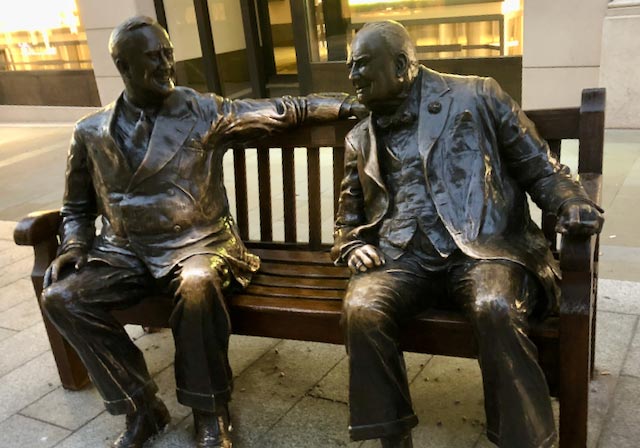 statue of men on a bench